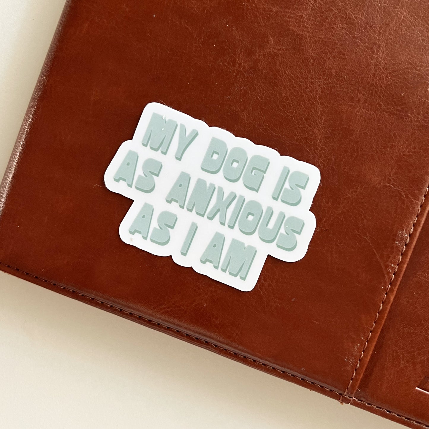 Anxious Dog Sticker on Notebook