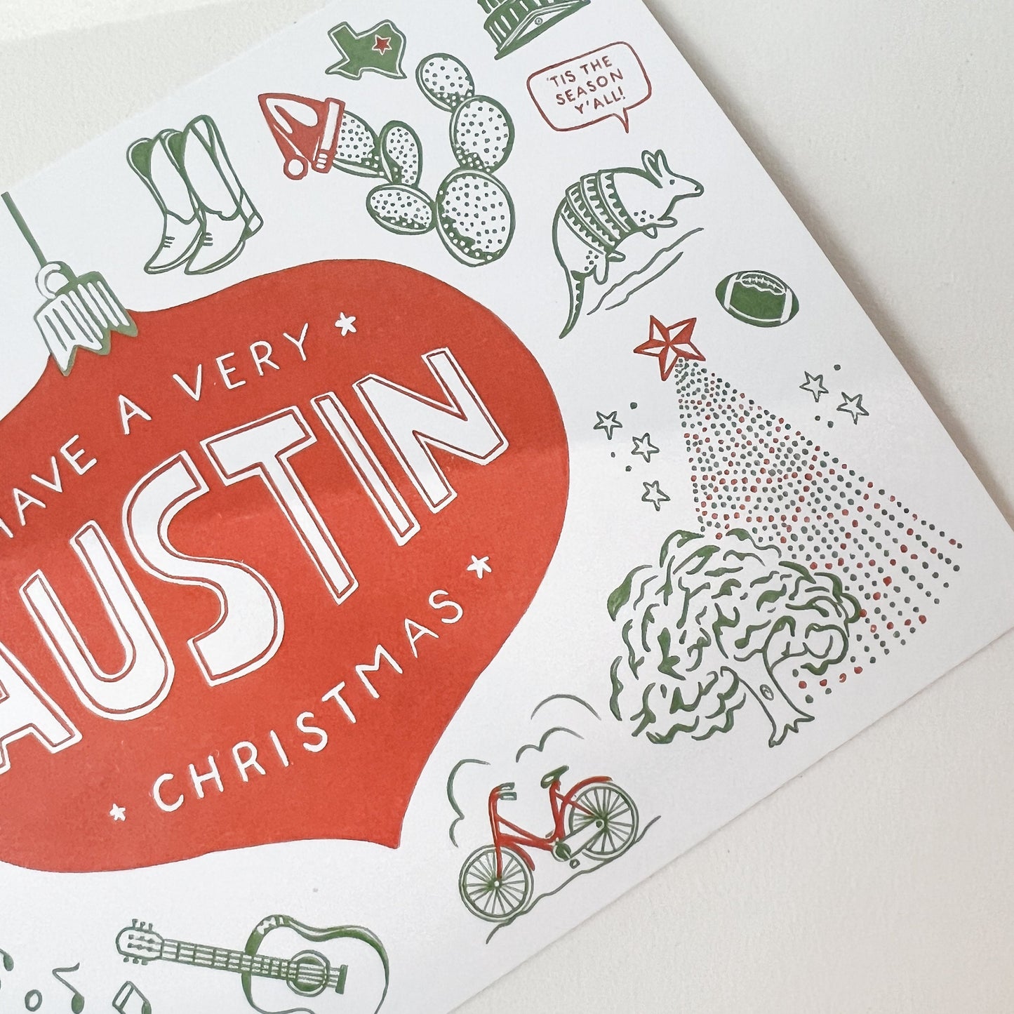 Close-up of holiday themed Austin postcard with message "Have A Very Austin Christmas"