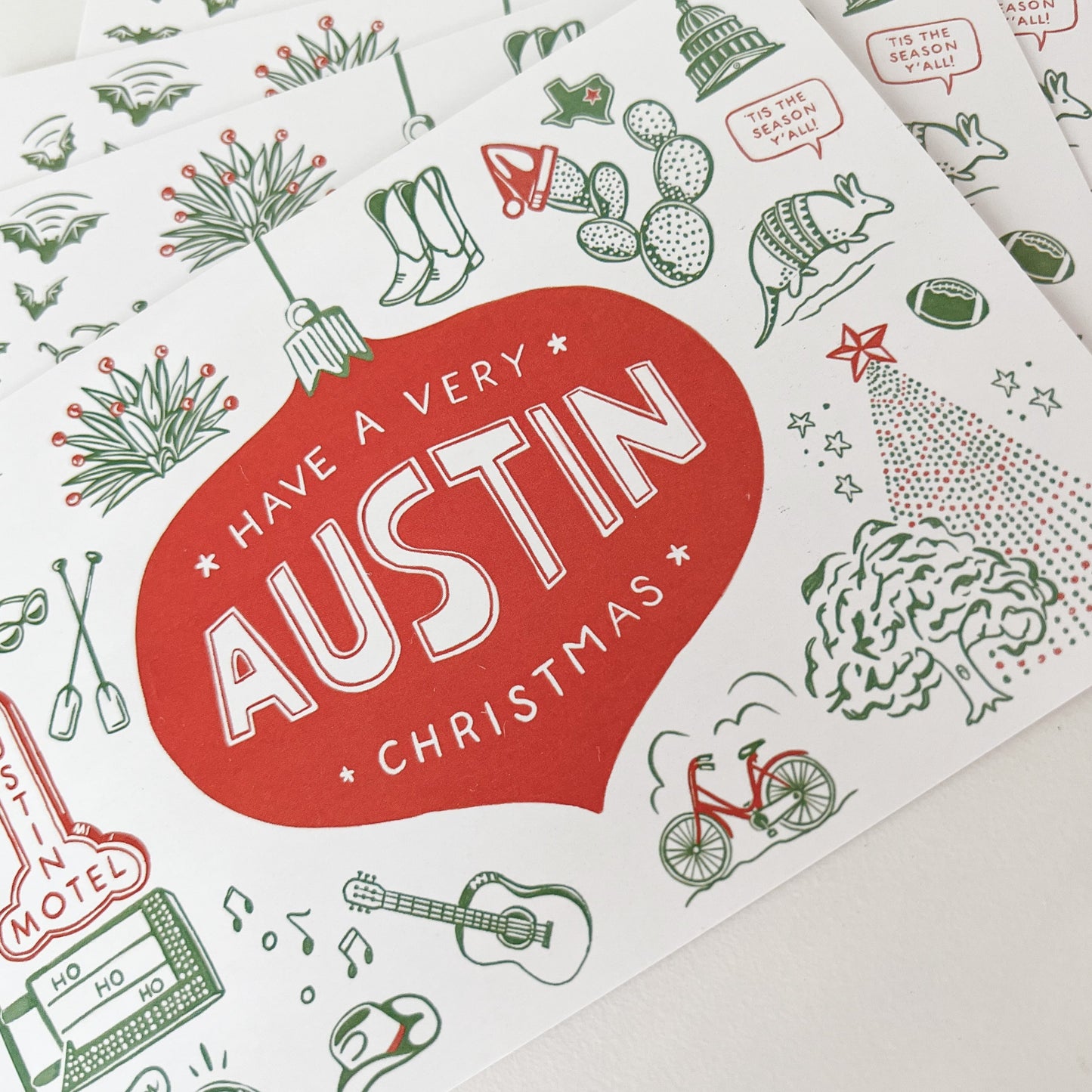 Stack of holiday themed Austin postcards with message "Have A Very Austin Christmas"