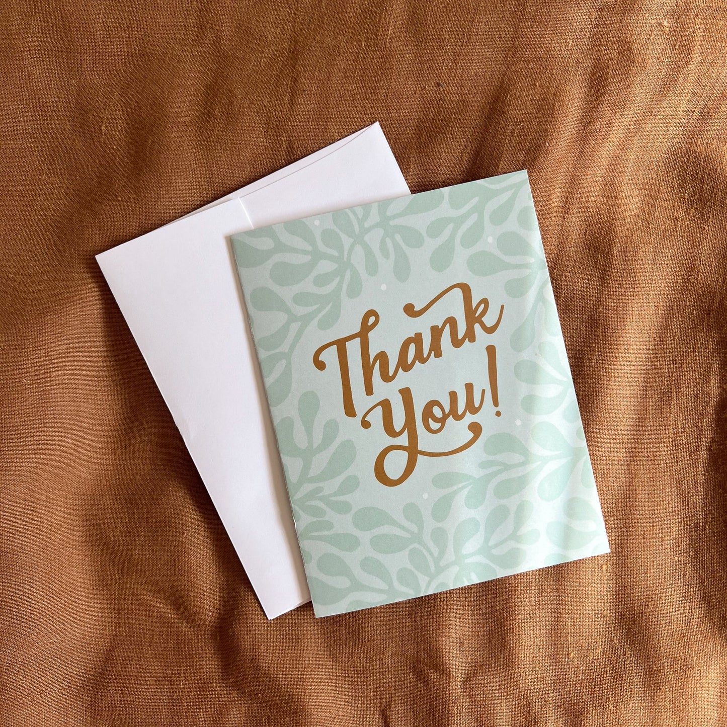 Thank You Card with white envelope shown from overhead.