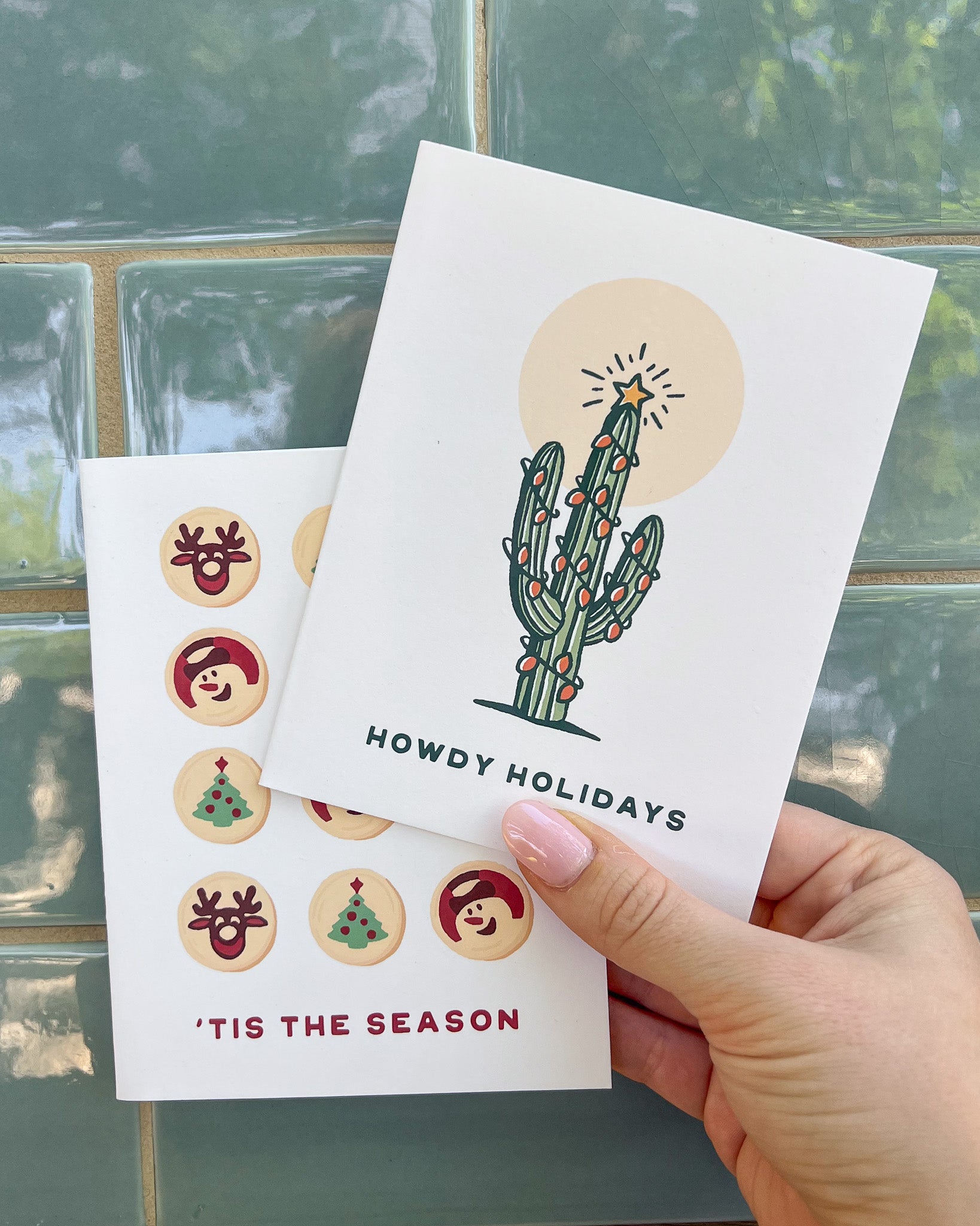 Holiday card with lots of Pillsbury Ready-To-Back holiday cookies with the message 'tis the season & a "howdy holidays" saguaro cactus card