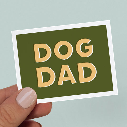 Green sticker with bold, yellow text that says Dog Dad