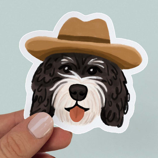 Waterproof vinyl sticker of a Bernedoodle in a cowboy hat