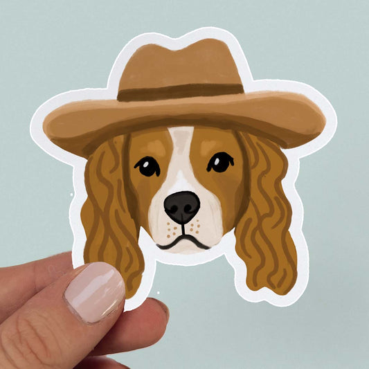 Waterproof vinyl sticker of a Cavalier King Charles Spaniel in a cowboy hat