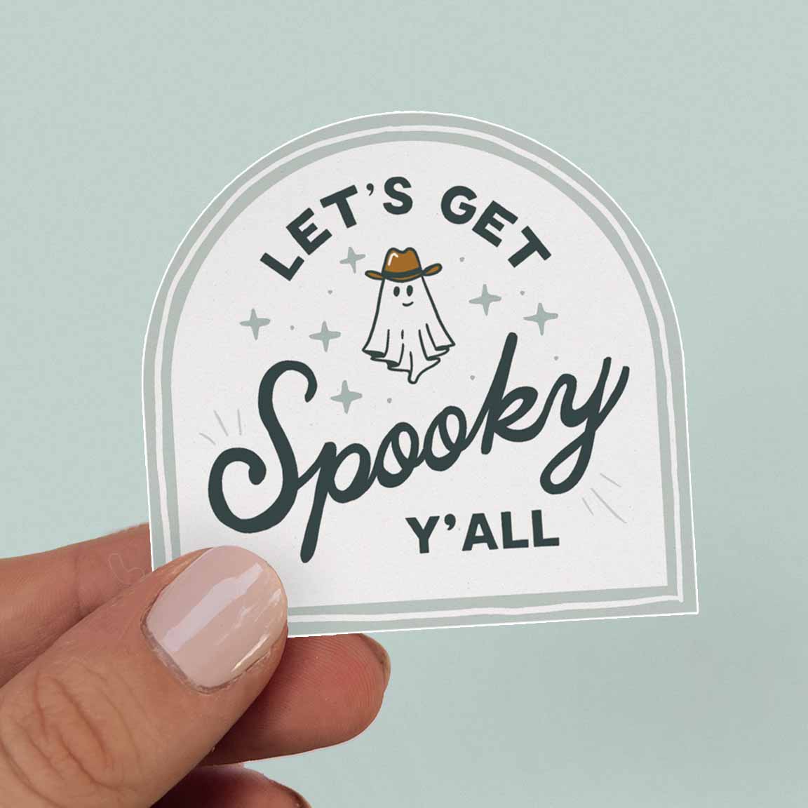 White Sticker with the quote "Let's Get Spooky, Y'all" featuring a ghost in a cowboy hat