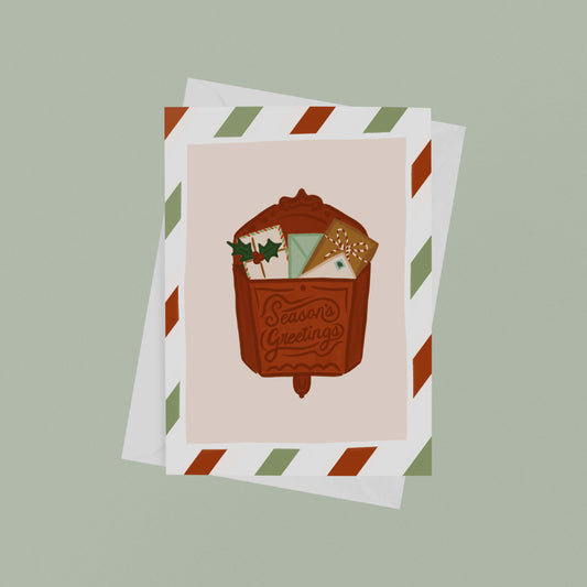 Holiday Card featuring a red vintage mailbox with the words "Season's Greetings"