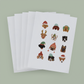 5 white cards with 12 dogs, each in a different holiday hat