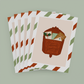 Stack of Holiday Cards featuring a red vintage mailbox with the words "Season's Greetings"