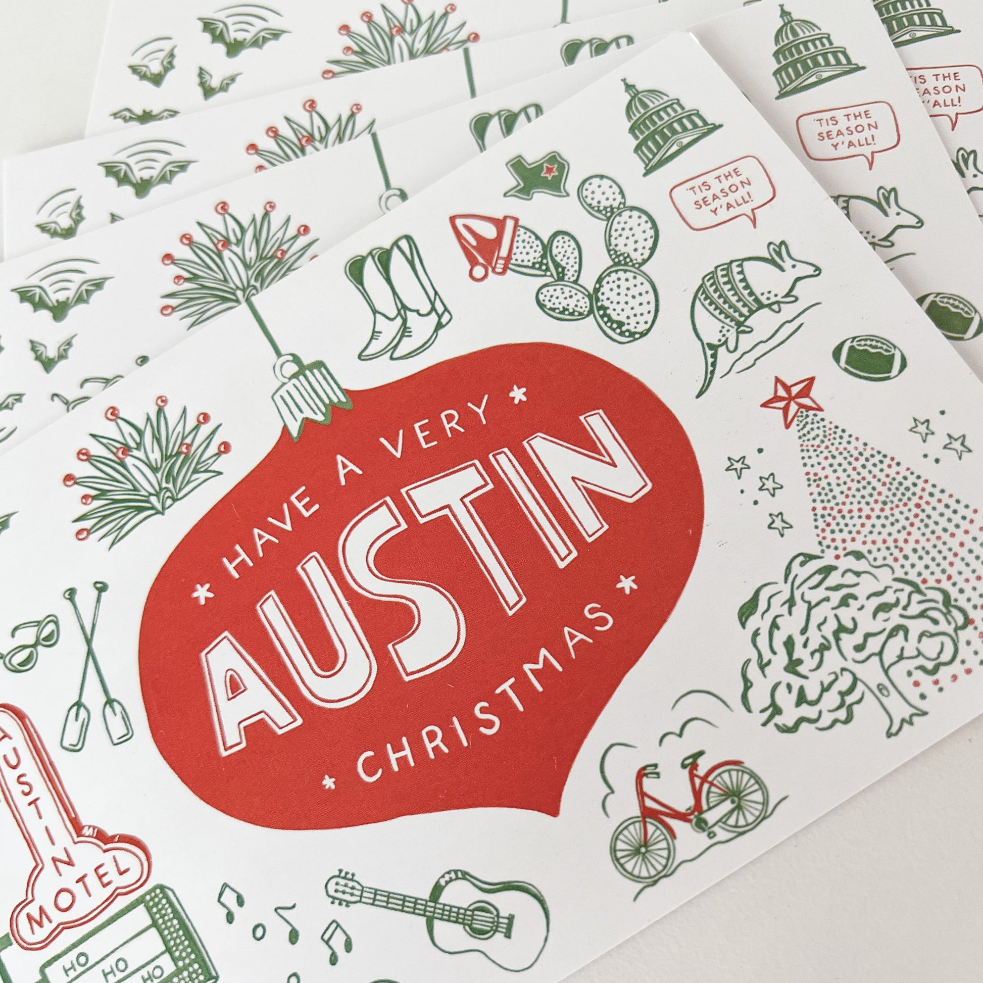 Stack of holiday themed Austin postcards with message "Have A Very Austin Christmas"