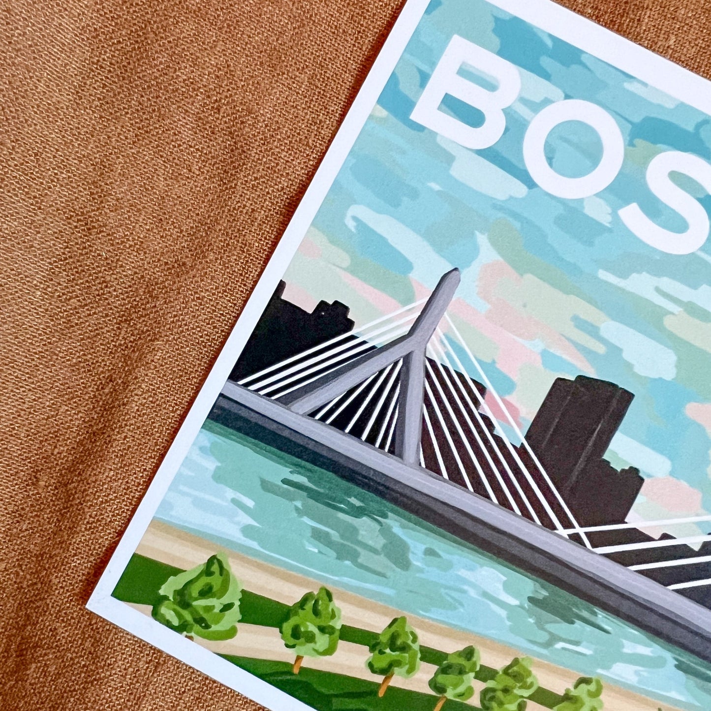 Close up of Boston postcard featuring the Zakim bridge at sunset