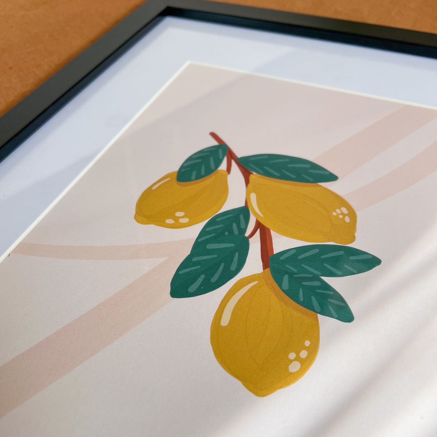 Close up of 8x10" Lemon Art Print in black frame.