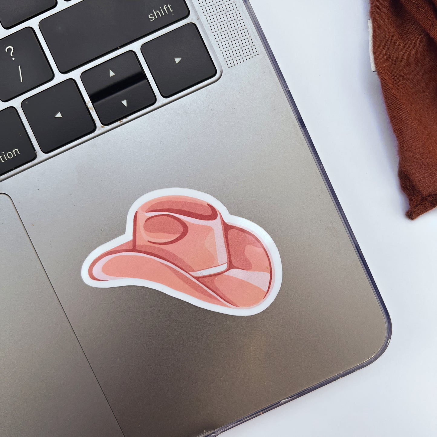 Pink Cowgirl Hat Sticker on laptop. 