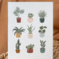 Greeting card with 9 plants in fun colorful pots on white background.
