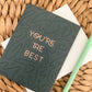 You're The Best Greeting Card with white envelope and green pen.