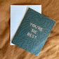 You're The Best Greeting Card and white envelope shown from overhead.