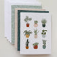 Stack of 4 mixed greeting cards with plant card on top and 4 white envelopes.