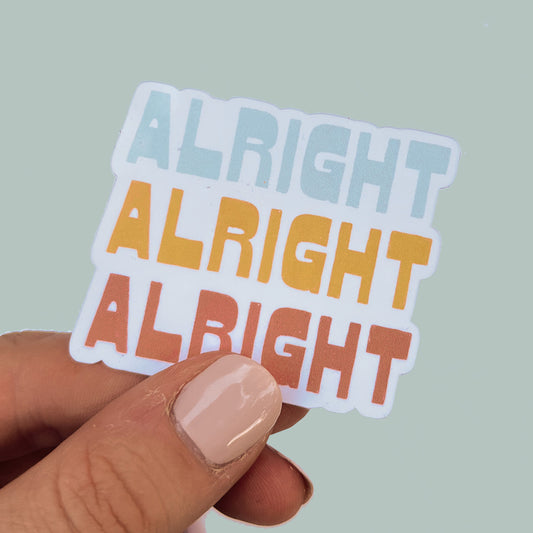 Sticker with quote "Alright Alright Alright" in multi-colored retro 70's lettering